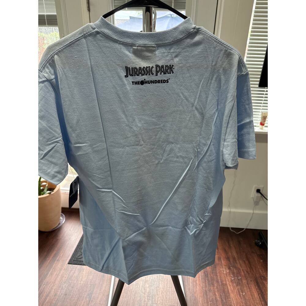 The Hundreds x Jurassic Park T-Rex SS Tee Men's Medium Light Blue NWT - Picture 2 of 3